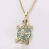 Pendentif tortue avec des petits strass bleu