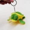 Porte-cles tortue resine fluorescente brille dans le noir